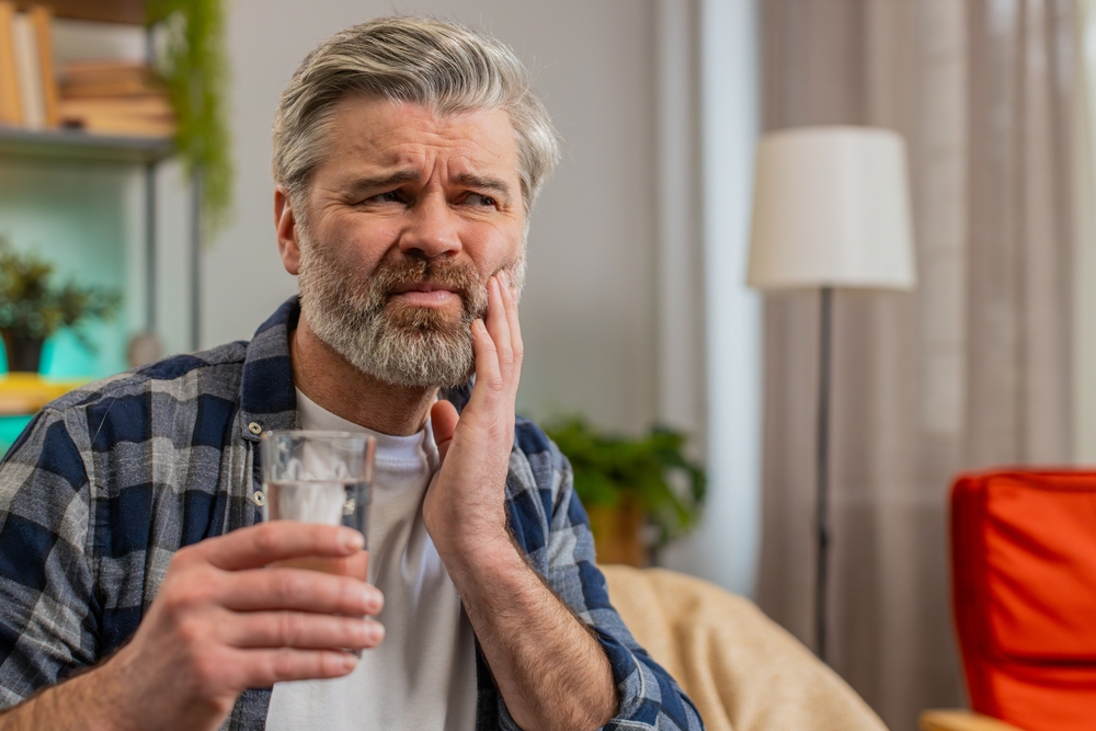 man wondering whether his dental pain is an emergency