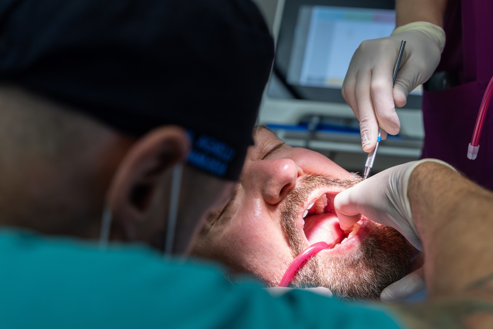 patient getting dental implants the same day as an extraction