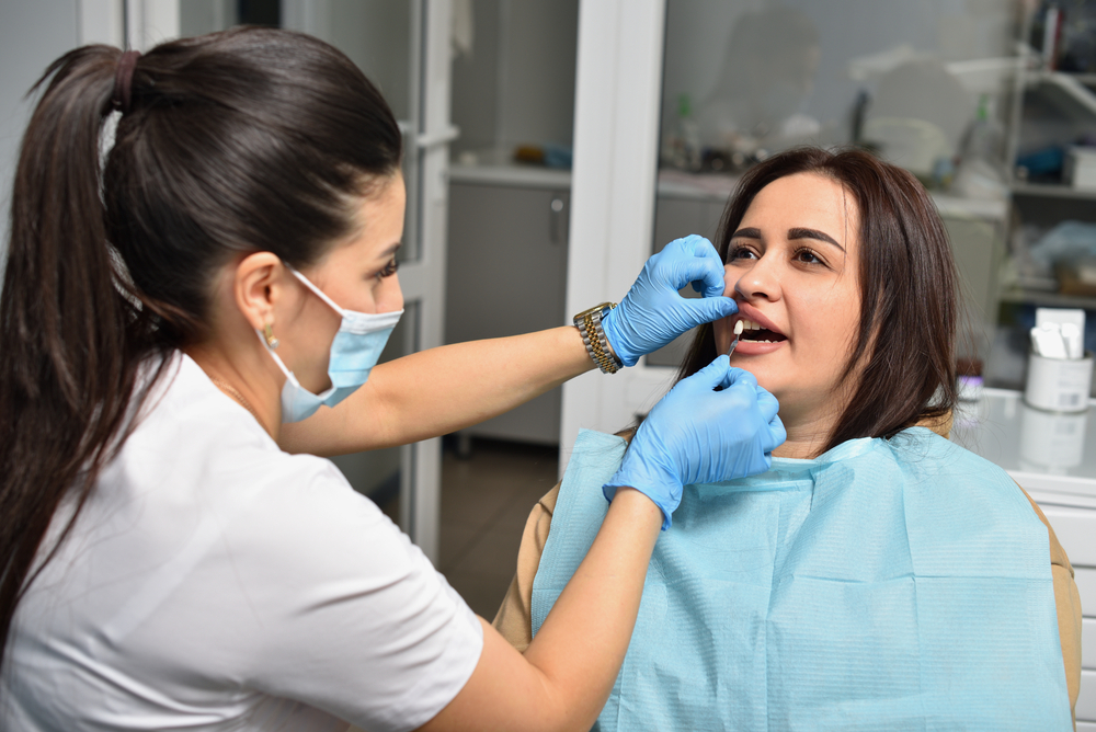 woman with peri-implantitis in Calvert County